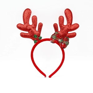 Detail of sequined red reindeer antlers headband with green holly leaves and plaid bow