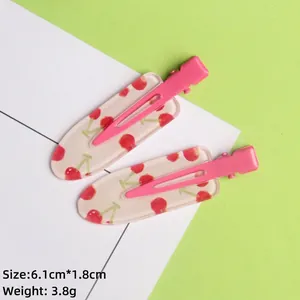 Detailed view of pink cherry acrylic hair clips with dimensions 6.1cm by 1.8cm