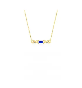 Detail of vintage gold necklace with rectangular blue gemstone and side diamonds