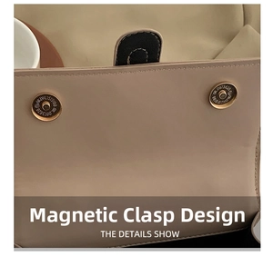 Detailed macro view showing the magnetic snap closure on the beige woven shoulder bag