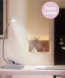 Detail of white clip-on LED desk lamp showing flexible gooseneck and USB charging port