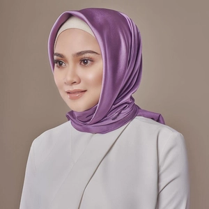 Detailed view of the purple satin silk hijab with elegant drapery and glossy finish