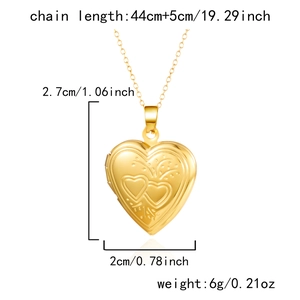 Detail of engraved gold heart locket necklace showing exact size and weight dimensions