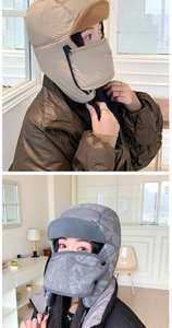 Detail view of winter ear-protection hat with zipper mask and warm fleece lining