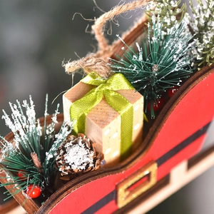 Festive Christmas wooden sleigh ornament with pine cones, berries and gift box decor