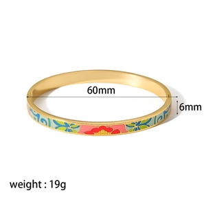 Detail view of 18k gold enamel floral bangle showing 60mm diameter and 6mm width specs