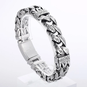 Detailed side view of men's stainless steel bracelet with Six-Word Mantra engraving