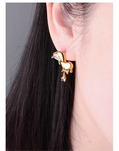 Detail view of 18K gold plated heart earrings with sparkling cubic zirconia on model