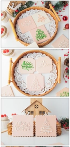 Detail von Weihnachts-Fondant-Keksen mit Merry Christmas-Mustern und festlichen Bäumen
