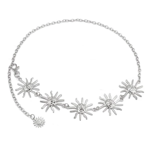 Detailed view of silver metal waist chain featuring sun face pendants and lobster clasp