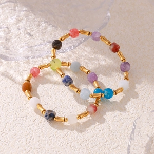 Bohemian natural stone beaded bracelets with gold-plated bamboo beads on a white background