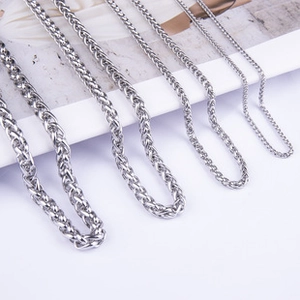 Detail view of silver stainless steel snake chains in various thicknesses and gauges