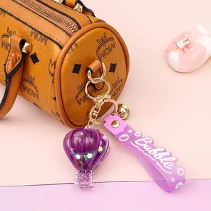 Purple glitter hot air balloon keychain with rubber strap and golden bell charm