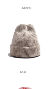 Detail of a thick khaki knit beanie featuring soft rabbit fur texture and ribbed cuff