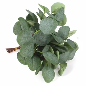 Detailed view of artificial eucalyptus leaves with frosted texture and gray-green round foliage
