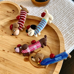 Set of four cute dachshund dog hair clips in colorful striped and plaid patterns