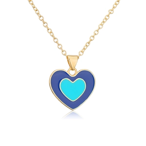 Detailed view of layered blue enamel heart pendant on an 18K gold plated chain necklace