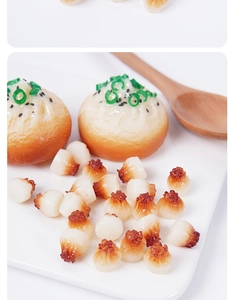 Detailed realistic simulation of pan-fried dumplings with green onions and sesame seeds