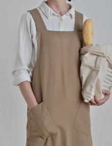 Close-up of khaki linen apron with two front pockets for gardening and home cooking