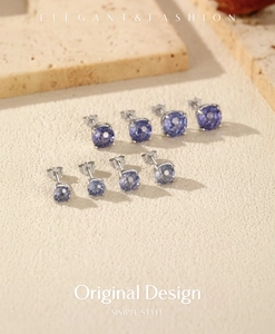 Detailed view of four pairs of S925 silver stud earrings with purple gemstone settings