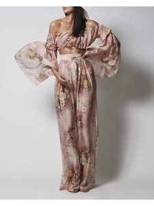 Detail of floral off-shoulder puff sleeve crop top and matching wide leg pants set
