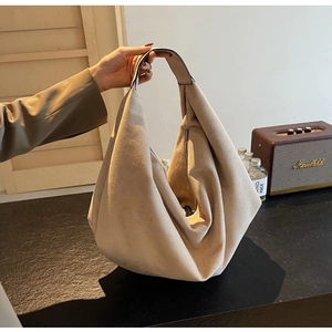 Detail view of the large matte faux suede hobo bag showing its soft texture and slouchy shape