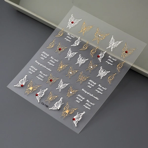 Detail of Co-148 butterfly nail stickers with red rhinestones and golden metallic lines