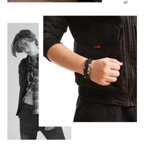 Close-up of men's multilayer black leather bracelet with lucky beads on a male wrist