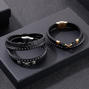 Detail of multi-layer braided leather bracelets with stainless steel infinity symbol charms