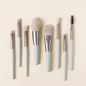 Detail view of 8pcs mini makeup brush set with light blue handles and soft synthetic bristles