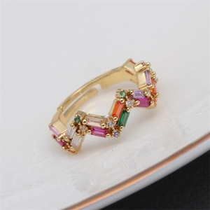 Micro-pave V-shaped wave adjustable ring with colorful zircons on a white ceramic plate