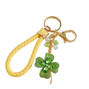 Colorful crystal four leaf clover keychain with yellow woven cord and gold metal ring