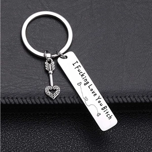 Minimalist stainless steel keychain with I F**king Love You Bitch engraved on black leather