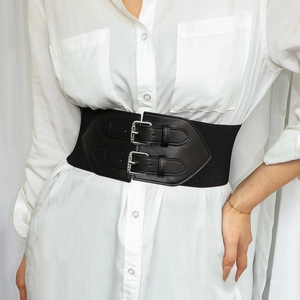 Detail of women's black elastic waist belt featuring double silver pin buckles