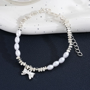 Exquisite pearl bracelet with silver butterfly charm and adjustable chain for women