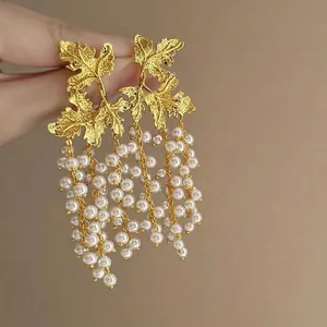 Vintage gold leaf earrings with pearl tassel fringe for elegant vacation style