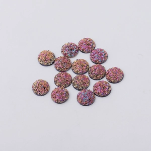 Detailed view of 12mm round resin druzy cabochons with iridescent metallic glitter texture