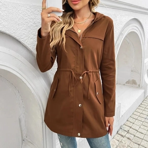 Detail view of brown hooded parka jacket featuring adjustable drawstring waist and metal buttons
