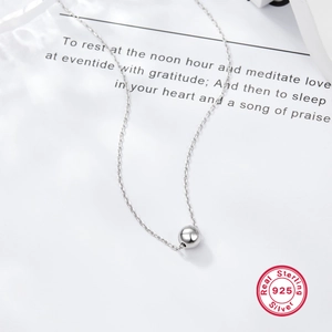 Elegant S925 sterling silver necklace with a polished bead pendant on white card