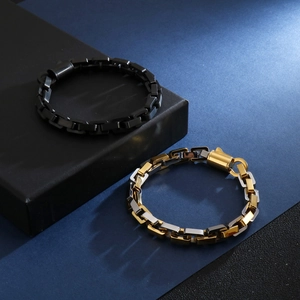 Mens hip hop chain bracelets in black and gold finishes on gift jewelry boxes