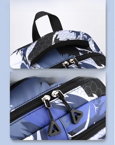 Detail of padded double handles and smooth dual zippers on camouflage backpack