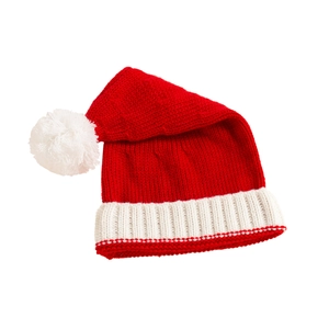 Detailed close-up of a festive red knit Christmas hat with soft white pompom and ribbed brim