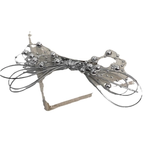 Elegant silver beaded bow hair claw clip with beige ribbon accent for women