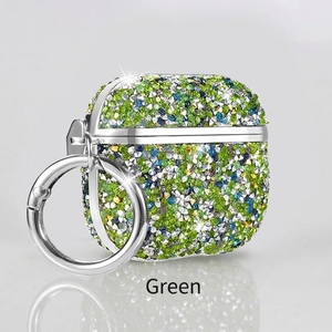 Close-up of green rhinestone AirPods 4 case with silver metal ring buckle and stand