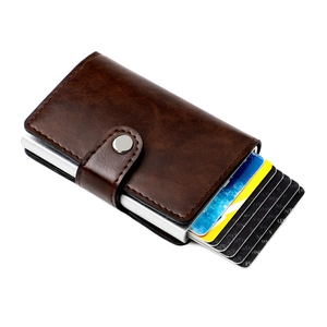 Detail of RFID blocking pop-up card holder in brown litchi leather with aluminum case