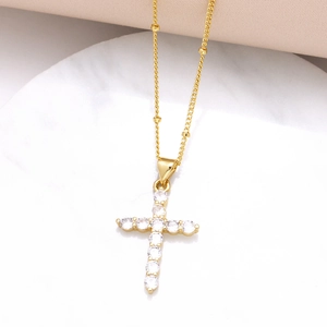 Gold plated cross necklace for women with sparkling white cubic zirconia inlay