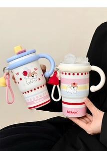 Close-up of model holding two cartoon coffee mugs with handles and dual-drink lids