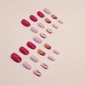 Barbie pink glitter swirl false nails set with French tips and short round shape