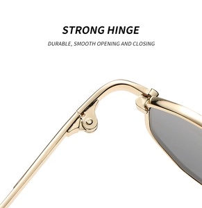 Close-up of durable golden metal hinges on minimalist polygon sunglasses