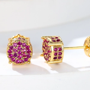Macro shot of gold-plated round earrings with micro-pave purple zircon and four-prong setting